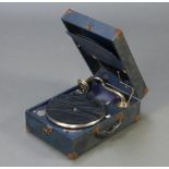 A Decca 75 portable manual gramophone complete with winder, contained in a blue fibre case 16cm h