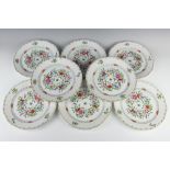A set of eight Herend plates decorated with basket weave moulding and painted flowers, 25cm diam