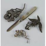 A silver marcasite floral brooch, 2 others and a fruit knife
