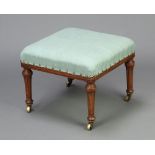 Holland & Son, a Victorian square walnut footstool upholstered in blue material, raised on turned