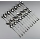 Twelve silver plated lily pattern dessert spoons and 12 ditto sundae spoons