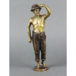 A bronze figure of a standing boy, the base marked Hubert 24cm x 5cm