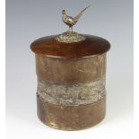 An Edwardian silver plated mounted wooden tobacco jar with pheasant finial and a hunting scene band