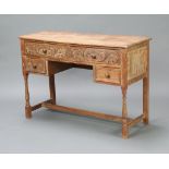 A 1930's Heals style limed oak dressing table, fitted 2 long and 2 short drawers with tore