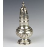 A Continental white metal sugar shaker with demi-fluted decoration 198 grams, 19cm