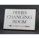 An oak and laminate table sign marked Peers Changing Room (from the House of Lords) 26cm h x