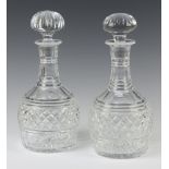 A pair of hobnail cut mallet shaped decanters with mushroom stoppers 24cm