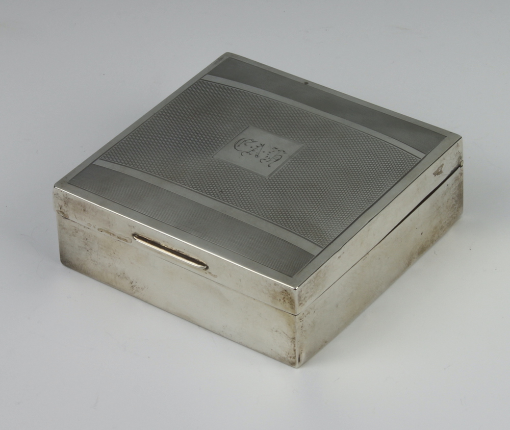 An Art Deco silver engine turned square cigarette box Birmingham 1932, 8cm x 8cm