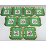 A set of nine Spode square dessert plates, the green ground enclosing a panel of exotic birds, 20.