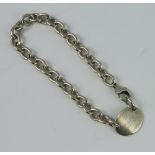 A silver bracelet with oval panel, marked Please return to Tiffany, 26 grams