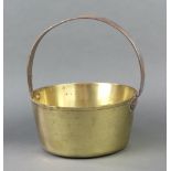 A circular brass preserving pan with polished steel handle, 29cm h x 25cm diam. Some light rust to