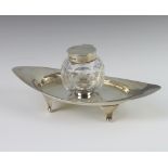 An Edwardian silver modernist inkwell with cut glass well and silver mounts, Birmingham 1902,