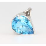 A 9ct yellow gold blue topaz pear cut ring, 16mm x 11mm, size M 1/2, 5.4 grams