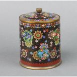 A black and floral ground cloisonne enamel cylindrical jar and cover decorated butterflies and