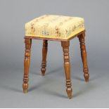 A Victorian square stool with Berlin style woolwork seat, raised on turned supports 53cm h x 34cm