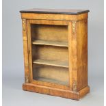 A Victorian inlaid walnut pier cabinet with gilt metal mounts, fitted shelves, raised on a