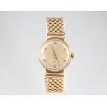 A gentleman's 9ct yellow gold wristwatch with seconds at 6 o'clock, contained in a 30mm case on a