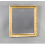 A 19th Century rectangular bevelled plate wall mirror contained in a decorative gilt frame 30cm x
