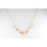 A 9ct yellow gold necklace with 2 colour heart drops, 1 marked 14k, gross weight 10 grams