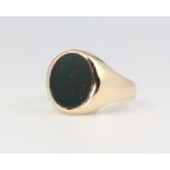 A 9ct yellow gold hardstone signet ring, size R, 4.7 grams gross
