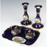 A 20th Century Dresden desk set comprising tray 24cm, pair of candlesticks 16cm and two ink pots