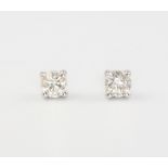 A pair of 18ct white gold single stone diamond ear studs 0.5ct, 1.5 grams