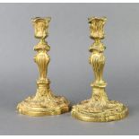 A pair of 19th Century gilt bronze Rococo style candlesticks 25cm h x 14cm