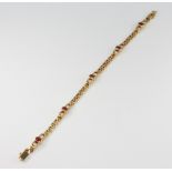 An 18ct yellow gold ruby and diamond bracelet, 14.2 grams gross