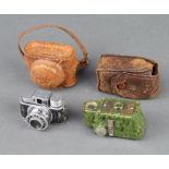 A Coronet midget camera finished in green marble effect and a Japanese Hit miniature camera