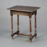 A Victorian 17th Century style carved oak side table, with carved apron, raised on turned and