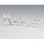 A Swarovski Crystal group of 4 parrots on a branch 10cm, a ditto of 2 doves 10cm and a pair of