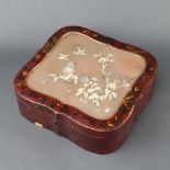 A red and pink lacquered trinket box, the signed hinged lid inlaid branches and flowers 9cm h x 26cm