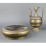 A circular Chinese gilt metal bowl of squat form engraved court figures on a plain base 10cm x