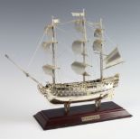 A 925 standard model of HMS Victory 242 grams, 30cm, raised on a wooden socle