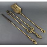 A Victorian style brass 3 piece fireside companion set with poker, tongs and shovel