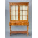 Signoretto, a Georgian style inlaid satinwood display cabinet, the raised back with moulded cornice,