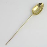 A Georgian silver mote spoon, gilded with rubbed marks