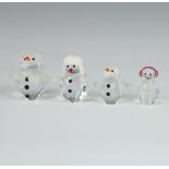 A Swarovski Crystal figure of a penguin wearing ear muffs 3cm, snowbaby 3.5cm, a Snowlady 5cm and