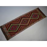 A red blue and green ground Suzni Kilim runner 250cm x 79cm