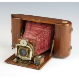 J Lizars of Glasgow, a Tropical Challenge Dayspool camera with teak body and red bellows. Fitted a