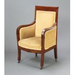 A 19th Century mahogany Biedermeier style armchair upholstered in yellow material, raised on