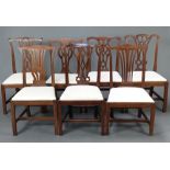 A harlequin set of 7 19th Century Chippendale style slat back dining chairs with upholstered drop in
