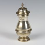 An Edwardian silver baluster pepper pot in the Queen Anne style, London 1907, 112 grams, 14cm