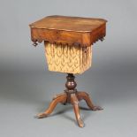 A Victorian rosewood lozenge shaped work box with hinged lid and deep basket, raised on tripod