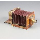 George Hare - a half plate mahogany tailboard camera with burgundy bellows, fitted a Thornton