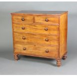 A 19th Century mahogany chest of 2 short and 3 long drawers with tore handles, raised on bun feet