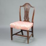 A 19th Century mahogany Hepplewhite camelback dining chair with overstuffed seat, raised on square