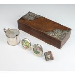 A rectangular oak box with Art Nouveau repousse silver mounts (part missing) together with 2