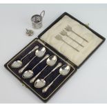 A set of 6 lily pattern silver coffee spoons, Birmingham 1925, 3 pickle forks, a rattle and a cup