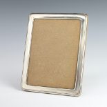 A rectangular silver photograph frame 24cm x 20cm